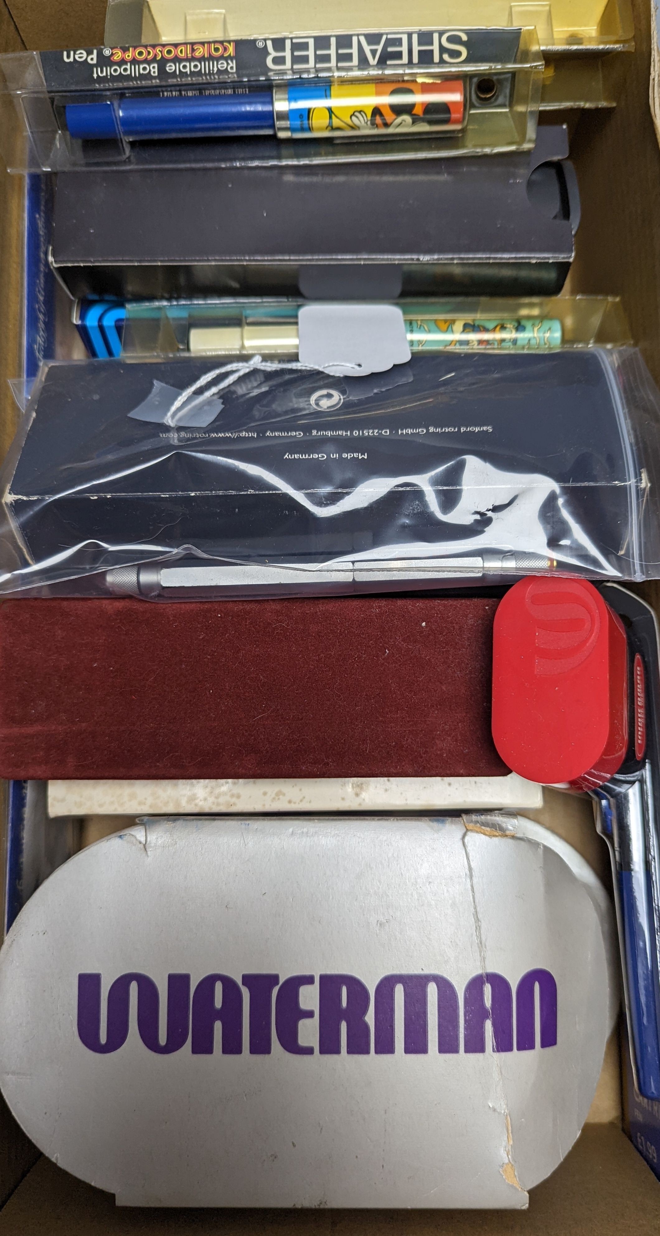 A collection of fountain pens, other pens, pencils and inks